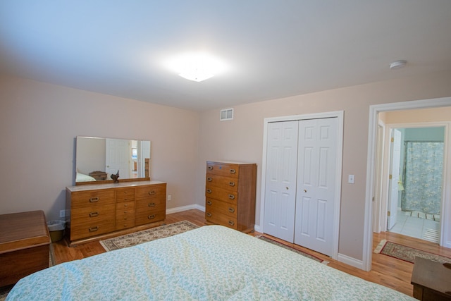 bedroom featuring light hardwood / wood-style floors and a closet