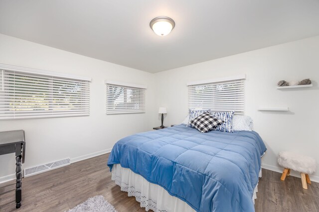 bedroom with wood-type flooring