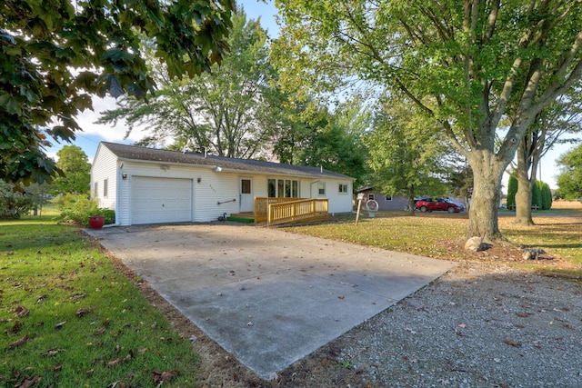 single story home with a garage, a front yard, and a wooden deck