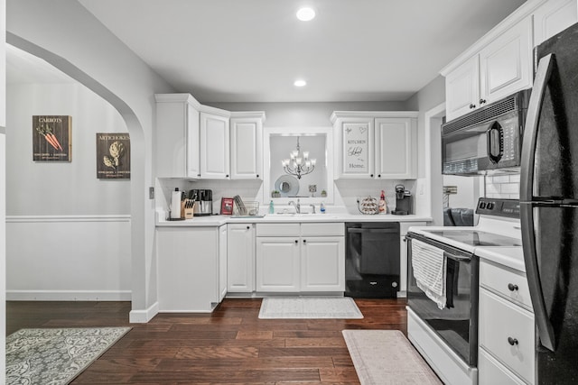 kitchen featuring backsplash, sink, black appliances, dark hardwood / wood-style floors, and white cabinetry