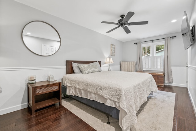 bedroom featuring ceiling fan and dark hardwood / wood-style flooring