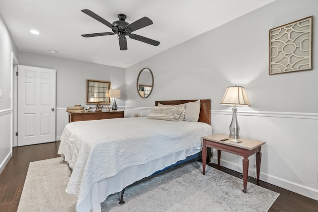 bedroom with ceiling fan and dark wood-type flooring