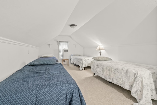 bedroom with carpet flooring and lofted ceiling