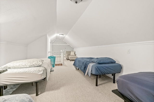 bedroom with light colored carpet and vaulted ceiling