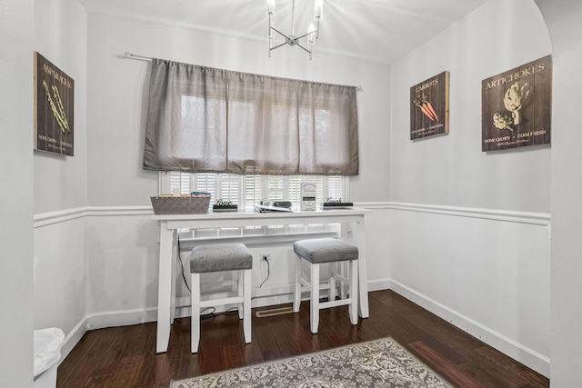 dining space featuring dark hardwood / wood-style flooring