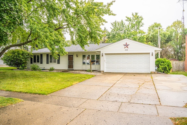 ranch-style home featuring a front lawn and a garage