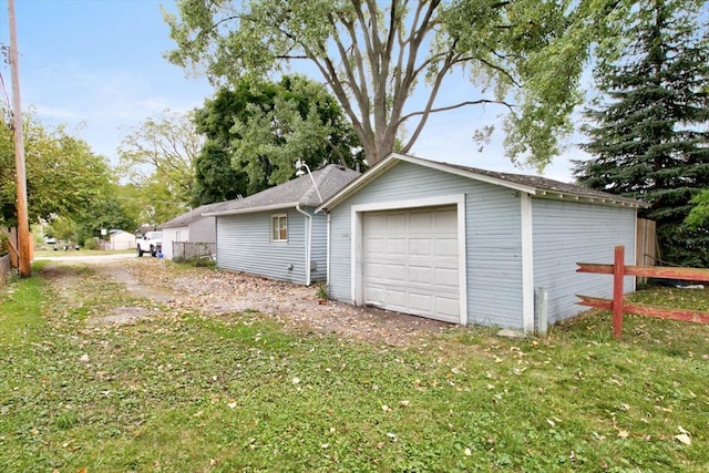 garage with a yard