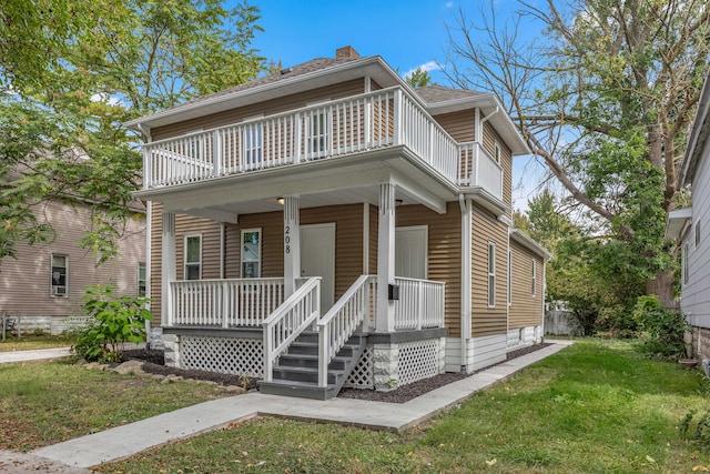 view of front of property with a front lawn and covered porch