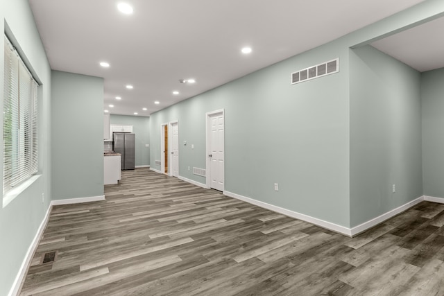 unfurnished living room with light wood-type flooring