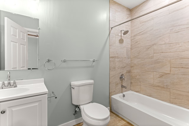 full bathroom featuring wood-type flooring, vanity, toilet, and tiled shower / bath