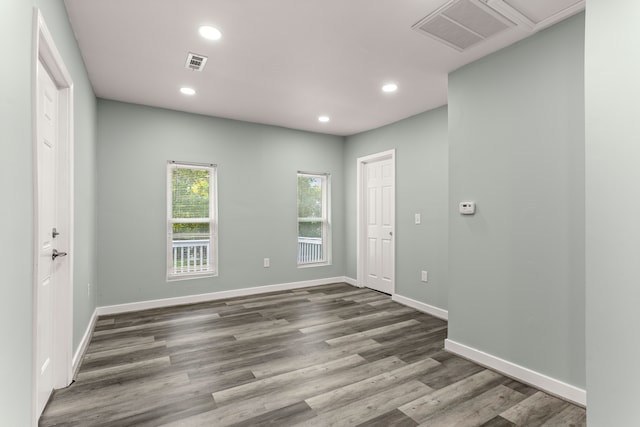 unfurnished room featuring dark hardwood / wood-style floors