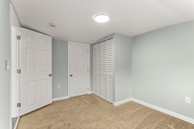 unfurnished bedroom featuring carpet flooring