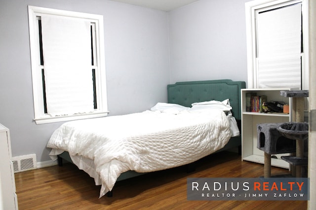 bedroom featuring dark wood-type flooring