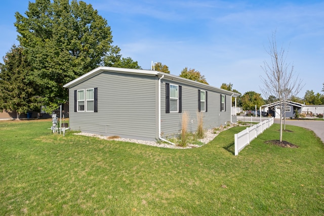 view of property exterior with a lawn