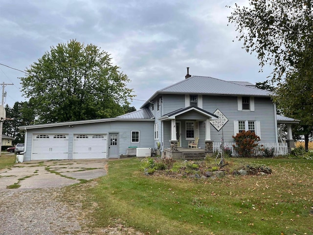 view of front of property featuring a garage and a front yard