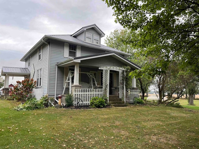 view of front of house featuring a front yard and a porch