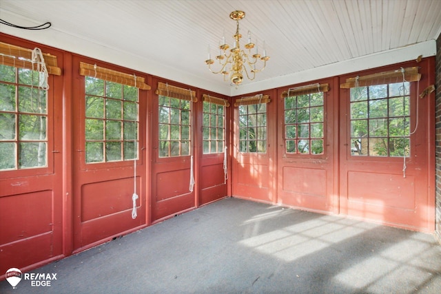 interior space with a chandelier and carpet