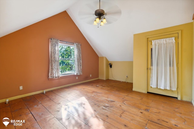 additional living space with hardwood / wood-style flooring, ceiling fan, and lofted ceiling