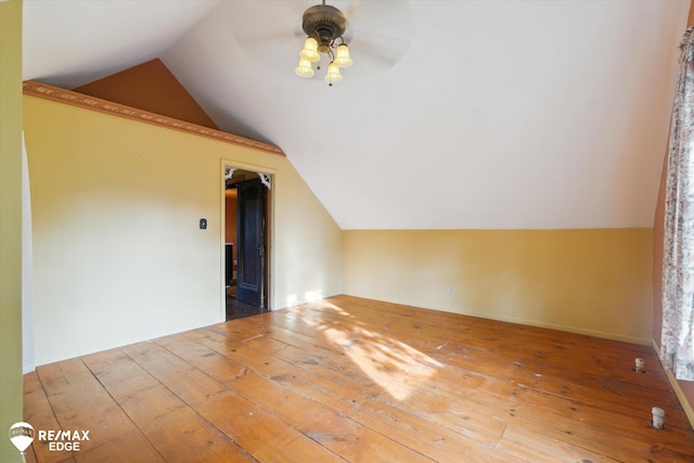 bonus room featuring hardwood / wood-style floors, vaulted ceiling, and ceiling fan