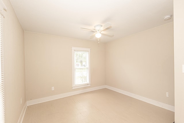 unfurnished room with ceiling fan