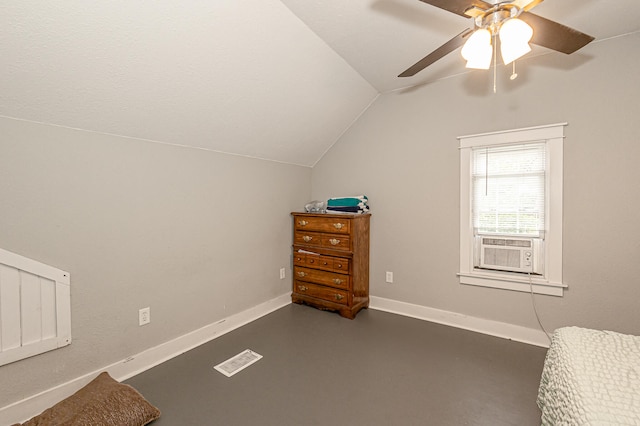 interior space with ceiling fan, cooling unit, and lofted ceiling