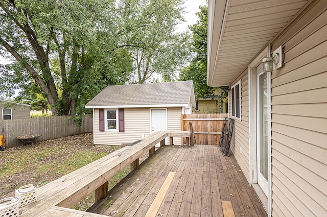 wooden deck featuring a storage shed