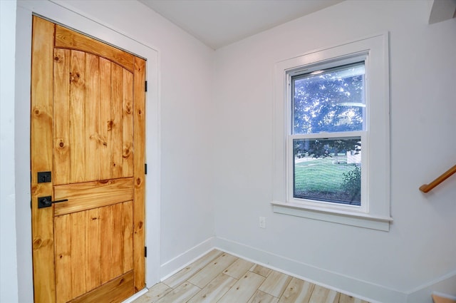 entryway with light hardwood / wood-style flooring