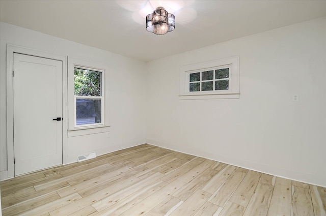 empty room with light wood-type flooring