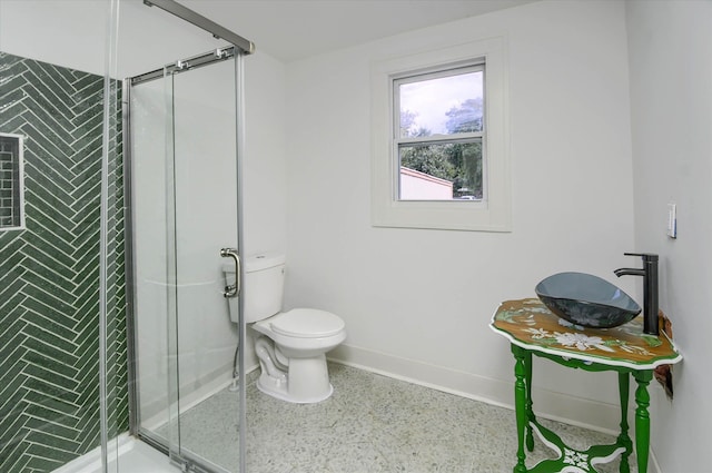 bathroom with walk in shower and toilet