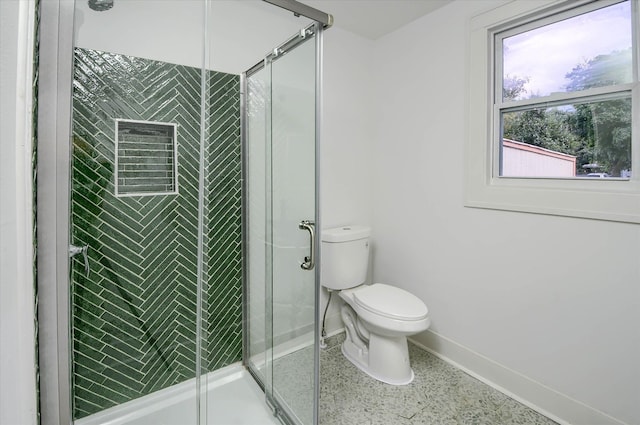 bathroom with an enclosed shower and toilet