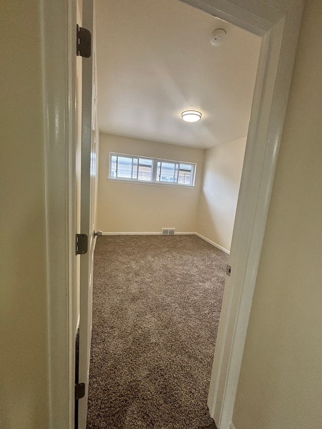 empty room featuring carpet floors