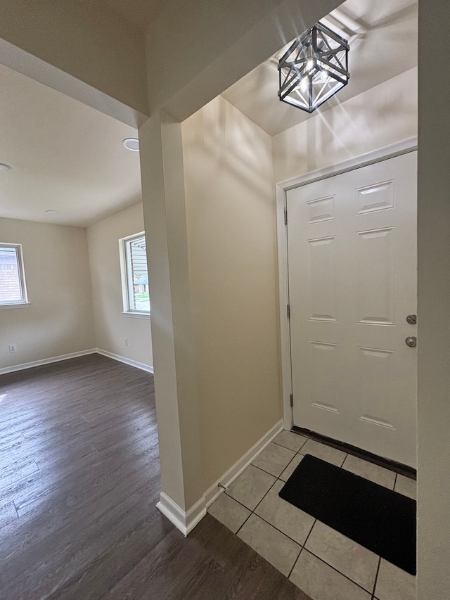 foyer entrance with plenty of natural light and hardwood / wood-style flooring