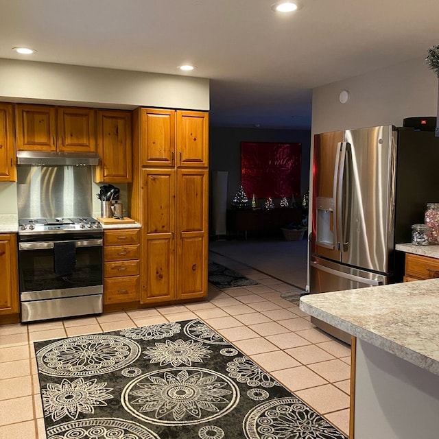 kitchen featuring appliances with stainless steel finishes and light tile patterned flooring