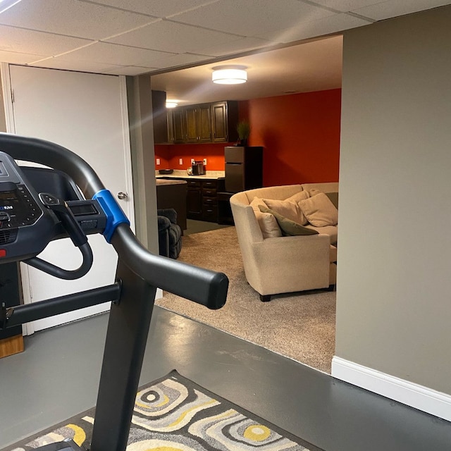 exercise area featuring a drop ceiling