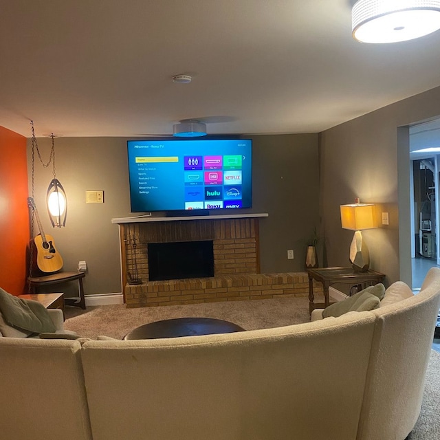 carpeted living room with a fireplace