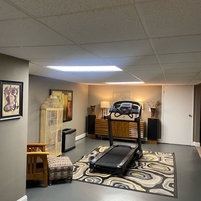 workout area featuring a paneled ceiling