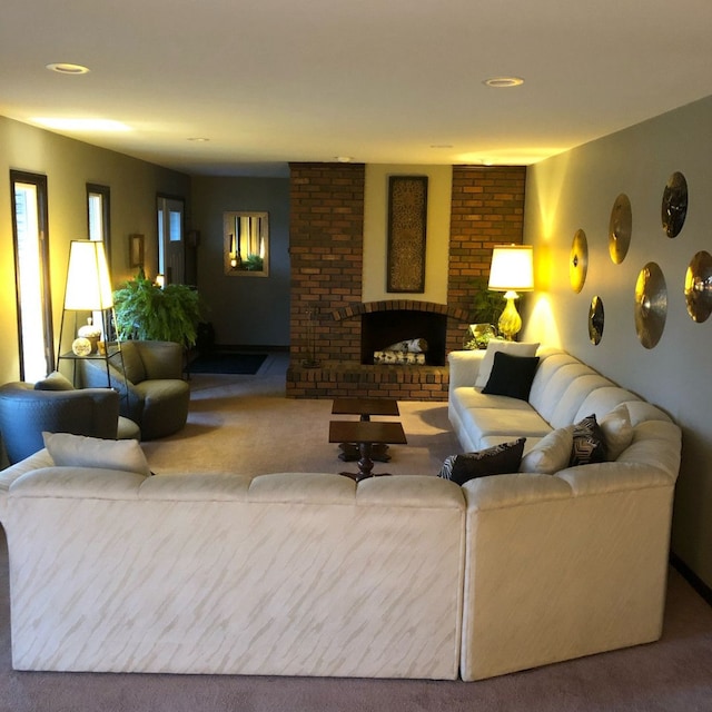 carpeted living room featuring a brick fireplace