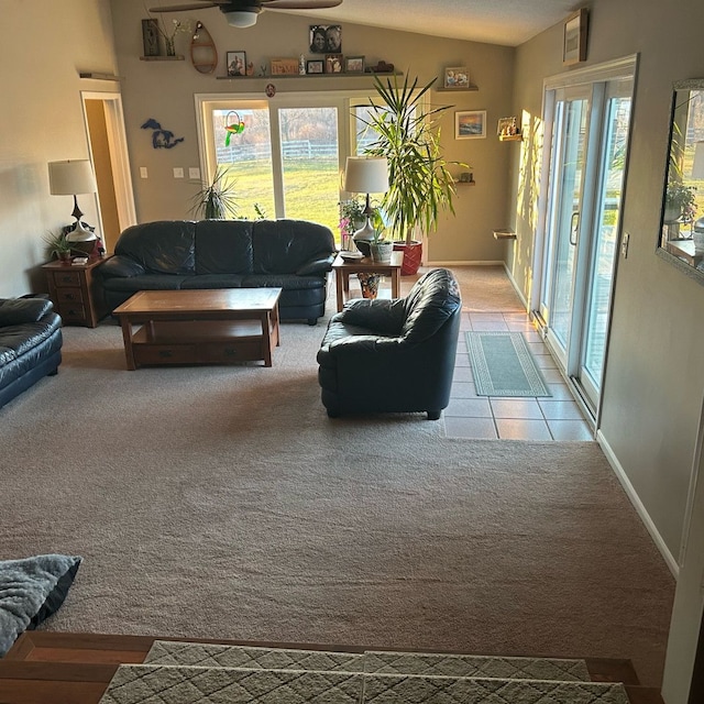 living room featuring carpet floors, ceiling fan, and lofted ceiling