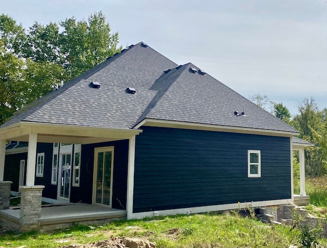 back of house with covered porch