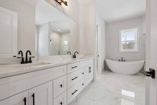 bathroom featuring vanity and separate shower and tub