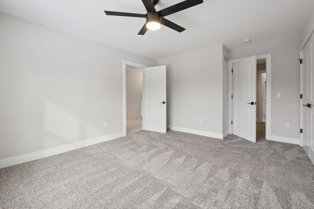 unfurnished bedroom featuring ceiling fan and carpet flooring