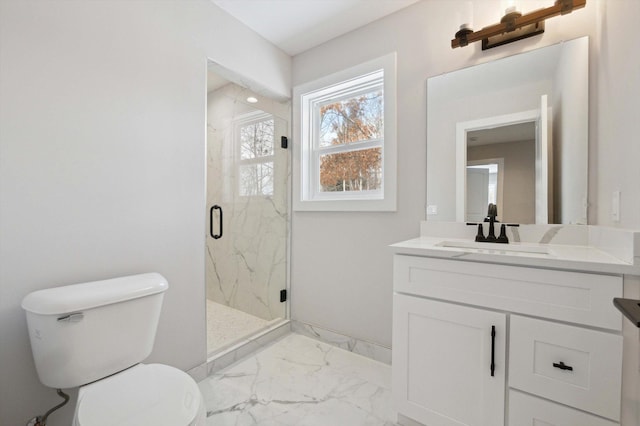 bathroom featuring walk in shower, vanity, and toilet