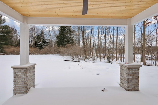 yard covered in snow with ceiling fan