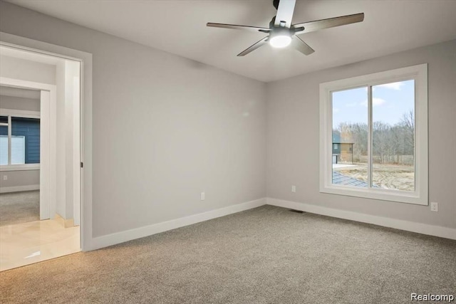 carpeted empty room with ceiling fan