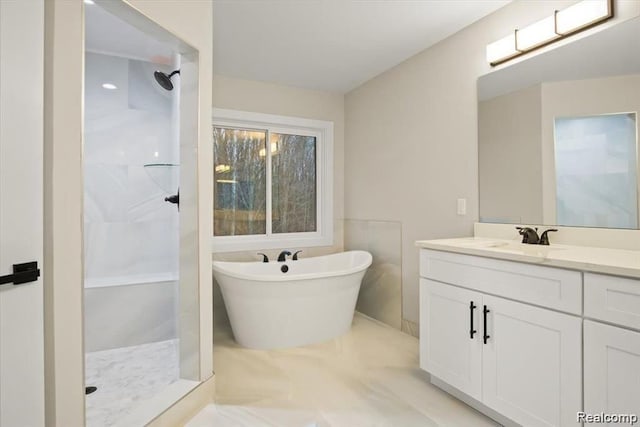 bathroom with tile patterned flooring, vanity, and separate shower and tub