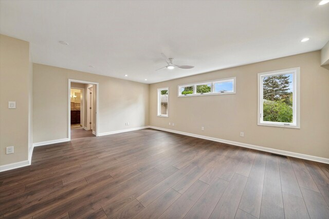 empty room featuring ceiling fan and dark wood-type flooring