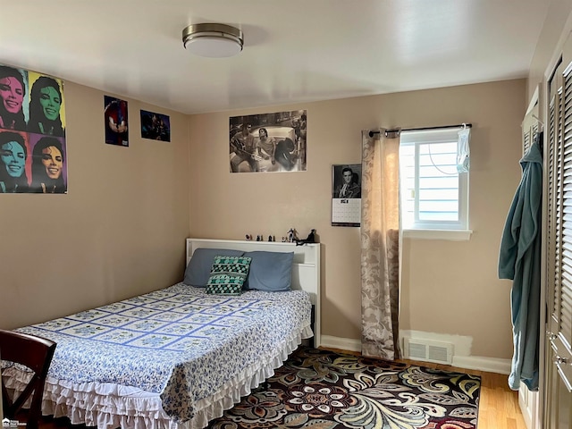 bedroom featuring hardwood / wood-style flooring