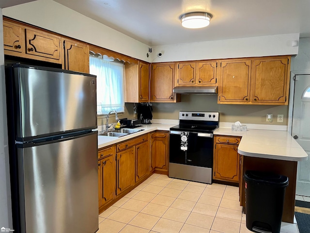 kitchen featuring sink, light tile patterned floors, and stainless steel appliances