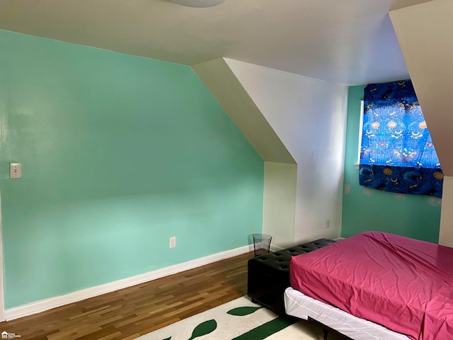 bedroom with hardwood / wood-style floors