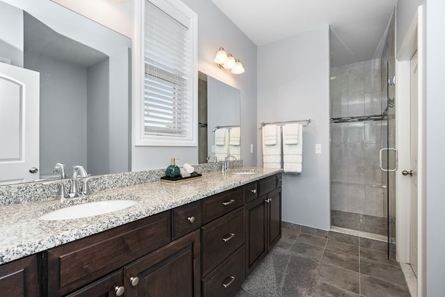 bathroom featuring vanity and an enclosed shower